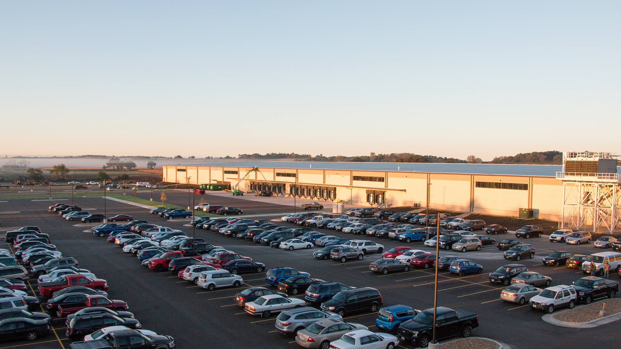 Manufacturing facility exterior and extensive parking